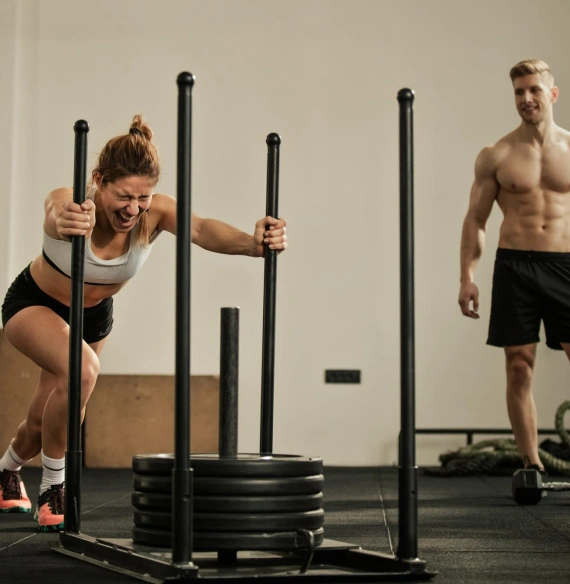 Women training with male coach